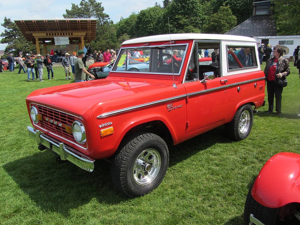 Red first-generation Ford Bronco wagon. Exact model year not identified. Photo: JOHN LLOYD from Concrete, Washington, United States, CC BY 2.0, via Wikimedia Commons (https://commons.wikimedia.org/wiki/File:The_Very_Popular_Bronco_(7316403924).jpg) Red first-generation Ford Bronco wagon